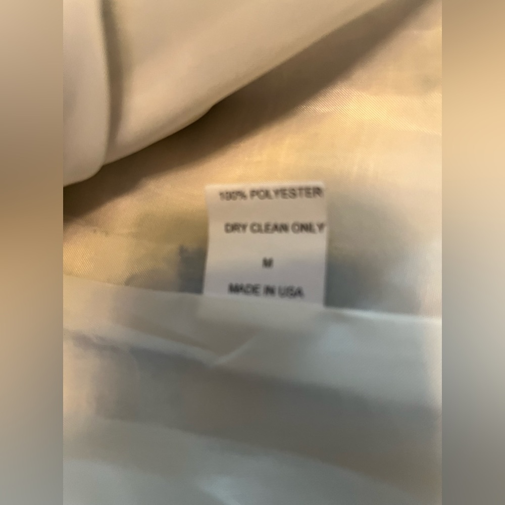 Medium size, short waist length jacket, pretty blue print and large buttons.